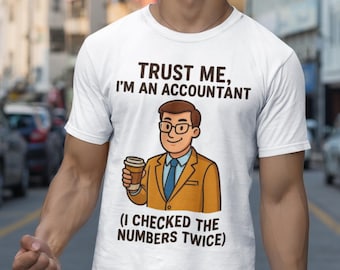 May include: White t-shirt with the text "TRUST ME, I'M AN ACCOUNTANT" and a cartoon accountant holding a coffee cup. The shirt also says "(I CHECKED THE NUMBERS TWICE)". The person is wearing white shorts and standing on a city street.