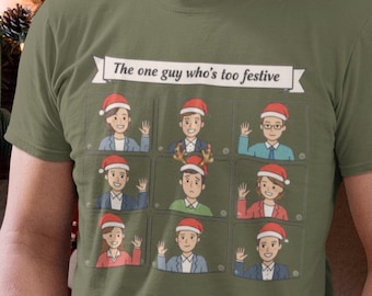 May include: Olive green t-shirt with the text "The one guy who's too festive" above a grid of nine cartoon figures wearing Santa hats. The person in the image is wearing blue jeans.