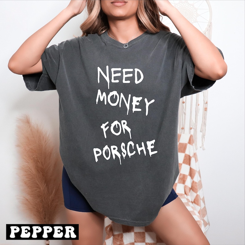 a woman wearing a shirt that says need money for porsche