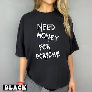 a woman wearing a black shirt that says need money for porsche