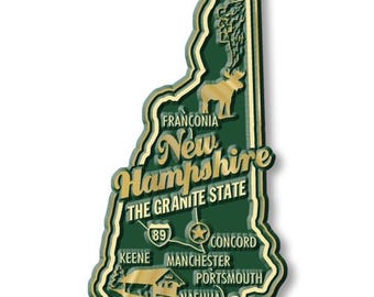 May include: A wooden magnet in the shape of New Hampshire, featuring the state's outline, cities, and a moose illustration. The magnet is green with gold accents and the text "New Hampshire, The Granite State".