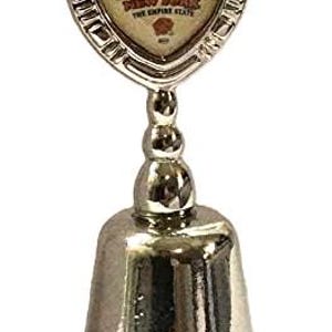 May include: Silver bell with a shield-shaped top featuring a colorful image of the New York City skyline and the text "New York The Empire State".