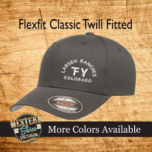 May include: A gray Flexfit Classic Twill Fitted hat with white embroidery that reads "Larsen Ranches FY Colorado". The hat has a black Flexfit logo on the back.