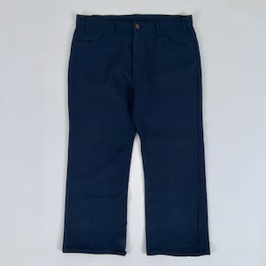 May include: A pair of navy blue pants with a button closure and pockets. The pants are made of a solid, dark blue fabric and have a classic, straight-leg design. The pants are displayed on a white background.