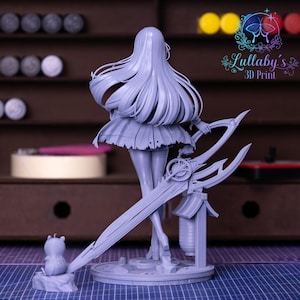 May include: A light gray 3D-printed figurine of a female character with long flowing hair, a short skirt, and holding a large, ornate sword. A small bear-like figure is on a rock at the base. The figurine is on a round base.