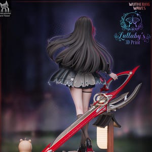 May include: A 3D-printed figurine of a character with long black hair, wearing a black dress and holding a large red and silver sword. The figurine is from "Wuthering Waves" and is labeled "Lullaby's 3D Print."