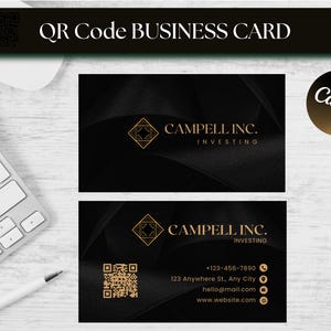 May include: Black business card design with gold accents. The card features the text "CAMPELL INC. INVESTING" and a QR code. The words "QR Code BUSINESS CARD" are at the top. The Canva logo is in the upper right corner.