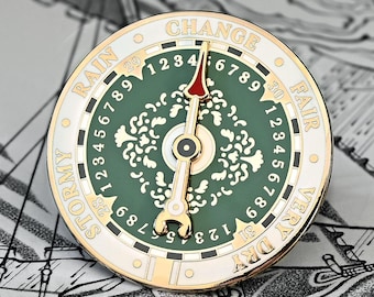 Pin de esmalte giratorio con barómetro meteorológico