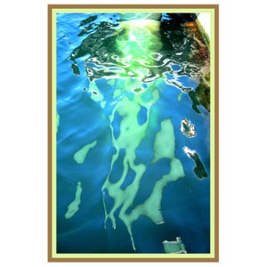 May include: Abstract art print featuring a close-up of water with light reflections. The image has a blue and green color palette, with a brown border. The water's surface has a rippled texture, creating an ethereal effect.