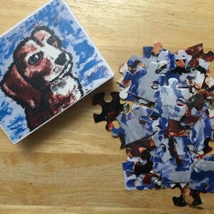 48-delige legpuzzel met schattige hond genaamd Penny erop. Wordt geleverd in een kleine kartonnen doos.
