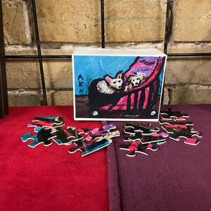 Legpuzzels van twee honden in een kinderwagen met 48 stukjes