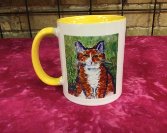 White and Yellow Mug with  an adorable Orange tabby cat on front.