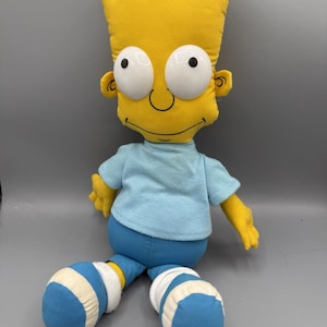 May include: A set of three ceramic mugs with a speckled, matte finish. The mugs are in shades of cream, light gray, and dark gray. Each mug has a simple, minimalist design, perfect for coffee or tea.