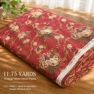 May include: A folded bolt of red fabric featuring a repeating floral pattern with cream and brown roses and green leaves. The fabric edge displays the text 11.75 YARDS, Vintage Home Decor Fabric, 100% Cotton, Great for Upholstery, Drapes, Pillows & More.