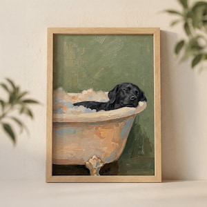 May include: A framed oil painting print featuring a black Labrador retriever resting inside a light-colored clawfoot bathtub filled with bubbles. The background is a solid muted green, and the artwork is encased in a light-toned wooden frame.