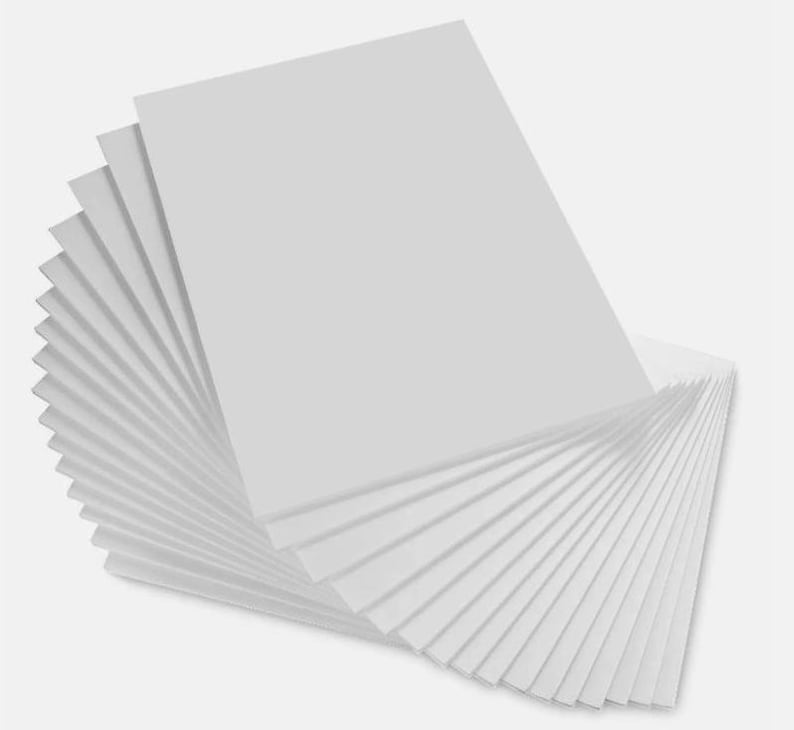 May include: A stack of white cardstock paper, fanned out to show the thickness of the paper.