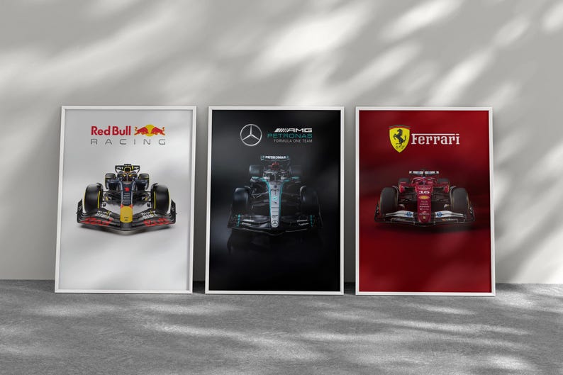 May include: Three framed posters featuring Formula 1 race cars. The first poster displays a Red Bull Racing car with the team's logo. The second poster showcases a Mercedes-AMG Petronas car. The third poster features a Ferrari car.