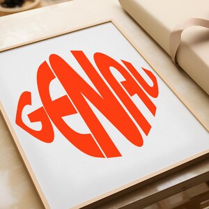 May include: A framed print with the word "GENAU" in a bright orange color, arranged in a circular shape.