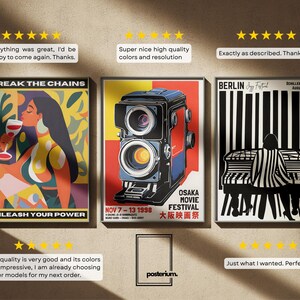 May include: Three framed art prints with vintage-style designs. One features a woman with a wine glass, another a retro camera, and the third a piano player. The prints have text that reads "BREAK THE CHAINS", "OSAKA MOVIE FESTIVAL", and "BERLIN Jazz Festival".