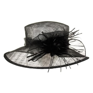 May include: A black wide-brimmed hat with a large black flower and feather embellishment.
