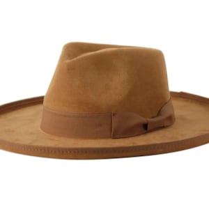 May include: A brown fedora hat with a wide brim and a brown ribbon tied in a bow at the front.