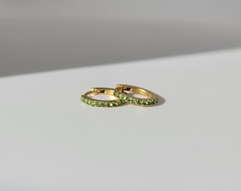 The Maija 'August' Peridot Birthstone 18k Gold Plated Stainless Steel Crystal Huggie Hoop Earrings.