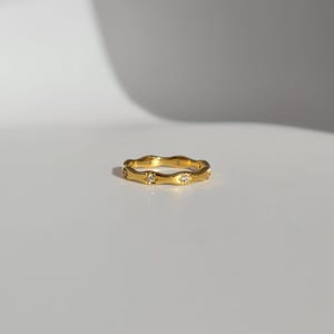The Hope 18k Gold Plated Stainless Steel Crystal Celestial Wavy Ring.
