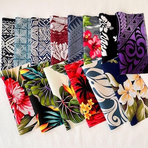 May include: A collection of 12 colorful fabric swatches featuring various tropical and geometric patterns. The swatches are arranged in a fan shape, showcasing a variety of colors and designs, including red, blue, green, purple, and white.