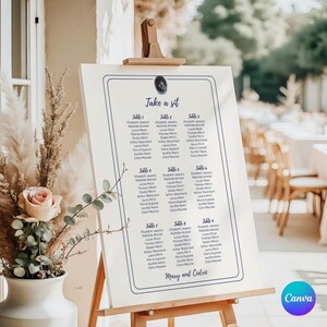 customizable beige wedding table plan sign with midnight blue writing, wedding or birthday plaque model in the garden