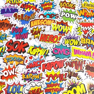 May include: A collection of colorful comic book-style stickers with various action words and exclamations. The stickers feature bold text in speech bubbles and starburst shapes, with words like "WOW," "BOOM," and "KAPOW!" in vibrant colors.