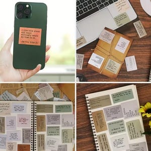 May include: A green phone case with a quote from "As You Like It" on a brown sticker. The image also shows a laptop, a notebook, and several small paper notes with text, suggesting a stationery or journaling theme.