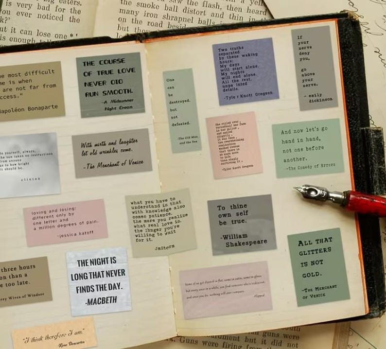 May include: A vintage book open to a page with several quote cards. The cards, in various colours, feature quotes from Shakespeare and other authors. A pen with a red handle lies on the page, enhancing the literary theme.