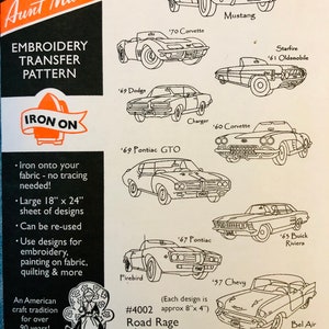 May include: A black and white embroidery transfer pattern sheet featuring classic American muscle cars from the 1960s and 1970s. The sheet includes a 1967 Ford Mustang, 1970 Corvette, 1969 Dodge Charger, 1969 Pontiac GTO, 1967 Pontiac Firebird, 1957 Chevrolet Bel Air, 1960 Corvette, 1963 Buick Riviera, and 1961 Oldsmobile Starfire. The sheet is titled "Road Rage" and is part of Aunt Martha's embroidery transfer pattern collection.
