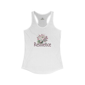 May include: White tank top with a pink and green watercolor lotus flower and the word "Resilience" printed on the front.