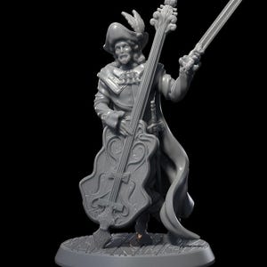 May include: A gray painted miniature figurine of a musician playing a large, ornate bass. The musician is wearing a feathered hat and a long coat. The figurine is standing on a round base.