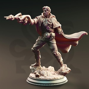 May include: A detailed figurine of a male character in a dynamic pose, holding a futuristic weapon. The figure wears a textured cape and armor, standing on a rocky base. The color palette is primarily shades of brown and tan.