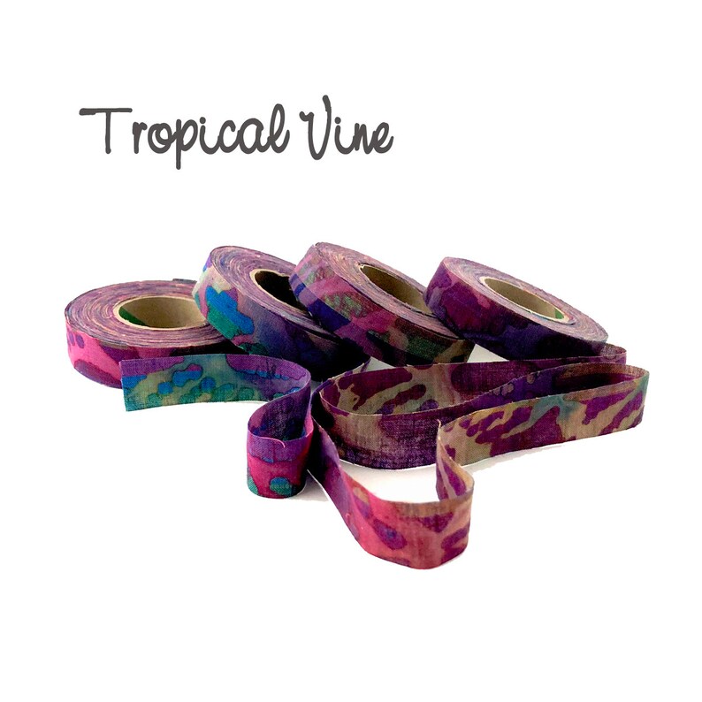 May include: Four spools of purple, pink, and blue patterned fabric ribbon with the text "Tropical Vine" above them.