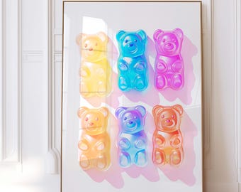 May include: A framed wall art print featuring six translucent gummy bear figures arranged in two rows. The bears are coloured in yellow, blue, pink, orange, purple, and a second orange, each casting a soft shadow on the white background.