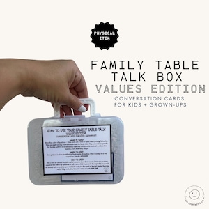 May include: A clear plastic Family Table Talk Box, Values Edition, held by a hand. The box contains conversation cards for kids and grown-ups. Text on the box reads "How to Use Your Family Table Talk". A black circular sticker says "Physical Item".
