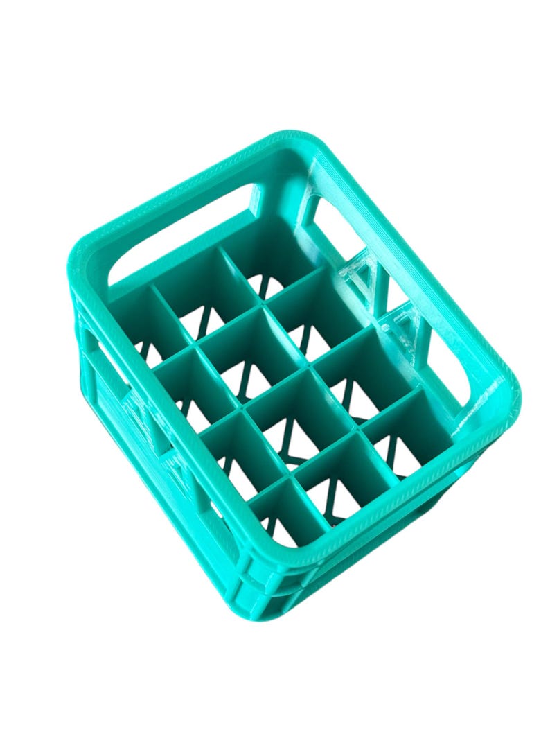 May include: A teal blue plastic crate with 12 compartments for holding bottles or cans.