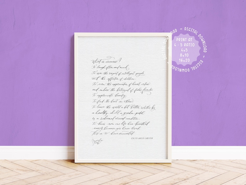 May include: A framed print with a white border, featuring elegant cursive text on a white background. The text is a quote about success. The print is displayed against a purple wall.