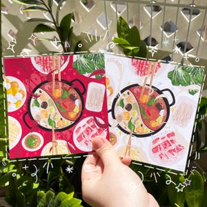 May include: Two illustrated cards with a red and white background featuring a hot pot with various ingredients, including meat, vegetables, and noodles. The text "Hot Pot" is written on the cards.