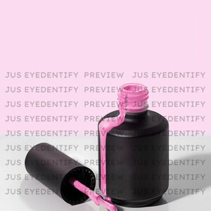 May include: A bottle of pink nail polish with a black lid and a brush. The bottle is tipped over and the polish is dripping out.