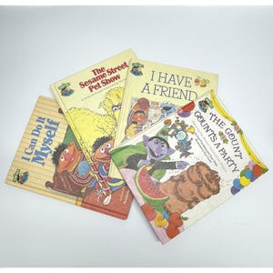 May include: Four vintage Sesame Street children's books. Titles include "I Can Do It Myself", "The Sesame Street Pet Show", "I Have a Friend", and "The Gount Counts a Party". The books feature colorful illustrations of Sesame Street characters.
