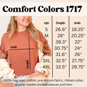 May include: A terracotta-colored Comfort Colors 1717 t-shirt. The image includes a size chart with measurements in inches for chest and length, ranging from size S to 4XL. The shirt is made of 100% ring spun cotton with a ribbed collar.