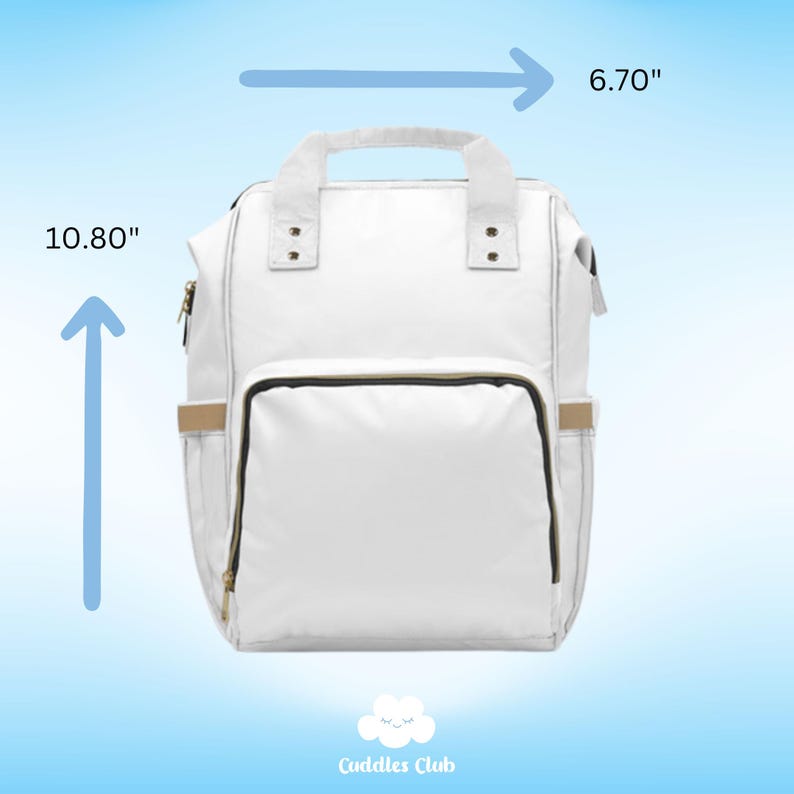 May include: White diaper bag backpack with gold accents and a black zipper. The bag measures 10.80 inches tall and 6.70 inches wide. Cuddles Club logo is at the bottom of the image.