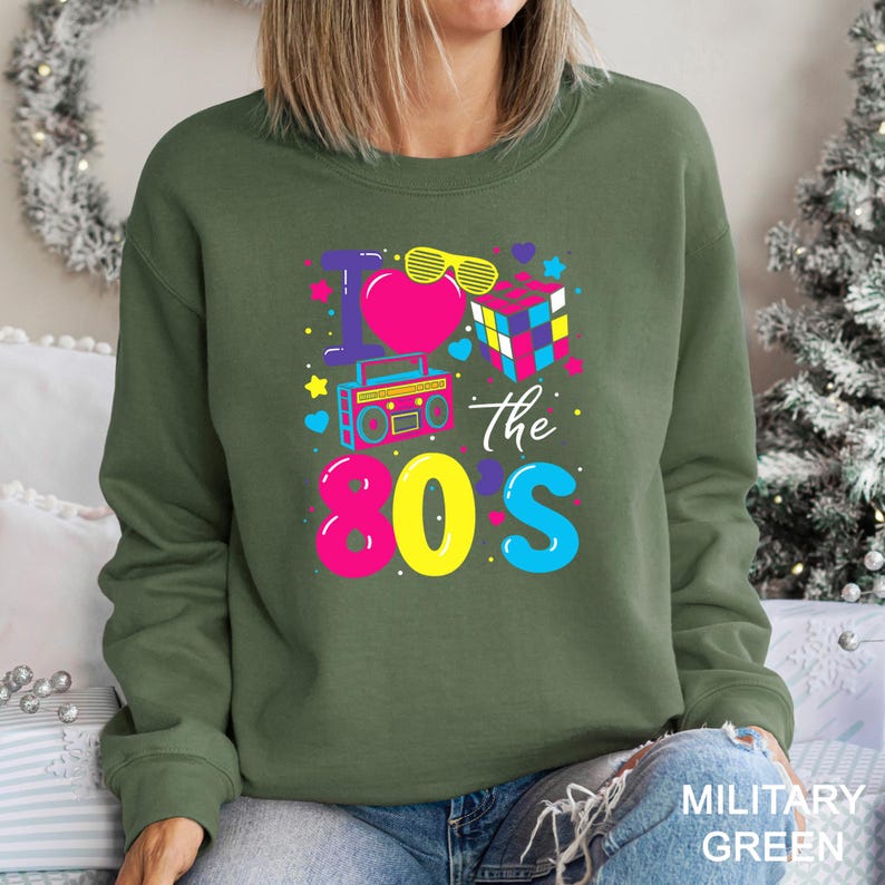 a woman wearing a green sweatshirt that says hope the 80ss