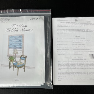 May include: A sewing pattern for flat back hobble shades, with instructions and yardage requirements. The pattern is for a window treatment that is easy to make and looks great in any room. The pattern is called "Flat Back Hobble Shades" and is number 9219.
