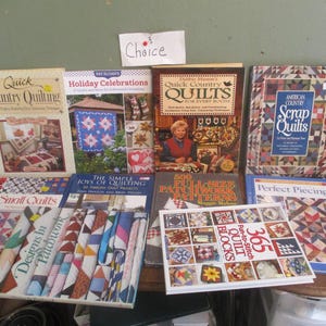 May include: A collection of quilting books with various titles, including "Quick Country Quilting", "Holiday Celebrations", "Quick Country Quilts for Every Room", "American Country Scrap Quilts", "The Simple Joys of Quilting", "500 Full-Size Patchwork Patterns", "Perfect Piecing", and "365 Patch-to-Stitch Quilt Blocks".