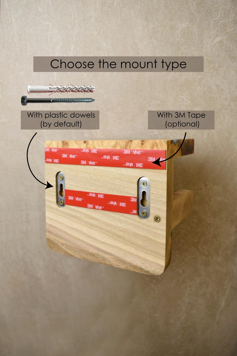 May include: A light-colored wooden wall shelf featuring two metal keyhole mounting plates on the back. The shelf includes red 3M adhesive tape strips for optional mounting and is shown with a white plastic dowel and a metal screw for installation.